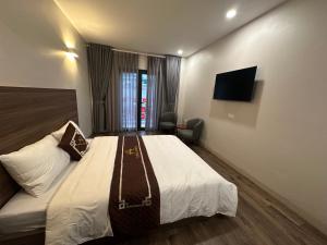 Μια τηλεόραση ή/και κέντρο ψυχαγωγίας στο Aurora Đồng Văn Boutique Hotel