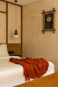 Ένα ή περισσότερα κρεβάτια σε δωμάτιο στο Calista Studios DUA Quaint 1 BR studio in Jungle 10 mins away from Uluwatu center