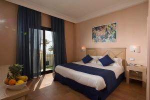 Postel nebo postele na pokoji v ubytování Mahara Hotel & Wellness