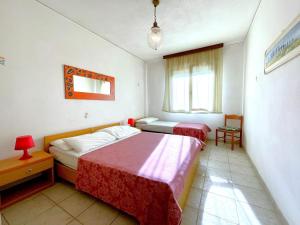 Ένα ή περισσότερα κρεβάτια σε δωμάτιο στο Apartment in Caorle near Beach and Pool +18 φωτογραφίες