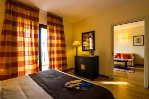Postel nebo postele na pokoji v ubytování Mahara Hotel & Wellness