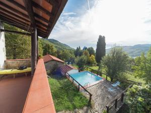 an image of a swimming pool on a house at Rustic Chalet with Pool in San Marcello Pistoiese