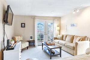 a living room with a couch and a table at Charming Cottage by Creek & Ocean in Blaine
