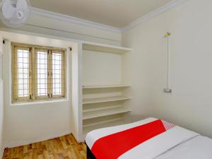 Ένα ή περισσότερα κρεβάτια σε δωμάτιο στο Hotel O SV