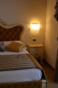 Postel nebo postele na pokoji v ubytování Agriturismo De Luca