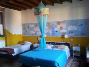 Postel nebo postele na pokoji v ubytování B&B Il Pioppo E La Fonte