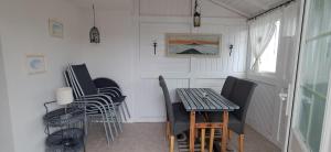 a small dining room with a table and chairs at Ferienhaus Brit in Albstadt