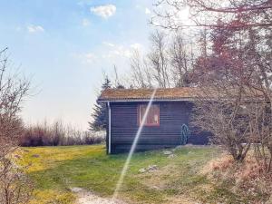 a small house in the middle of a field at 6 person holiday home in Spøttrup-By Traum in Lihme