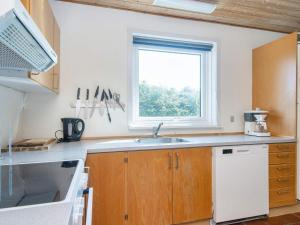 a kitchen with a sink and a window at 8 person holiday home in Odder in Odder