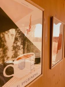 a window with a picture of a car in it at Ostrov klidu - posed - sauna in Hradešín