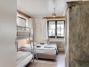 a bedroom with two bunk beds and a window at Chalet in Leogang near Ski Lift & Bikepark in Leogang