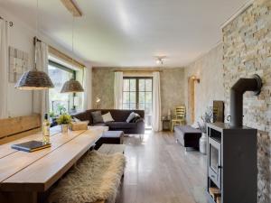a living room with a couch and a table at Chalet in Leogang near Ski Lift & Bikepark in Leogang