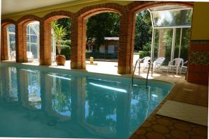 a swimming pool in a house at Chateau-camping la Grange Fort, 63500 Les Pradeaux in Les Pradeaux