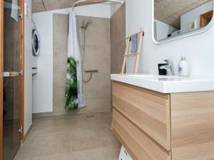a bathroom with a sink and a shower at 6 person holiday home in Bjert-By Traum in Sønder Bjert