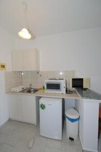 Η κουζίνα ή μικρή κουζίνα στο Anastasia Apartments