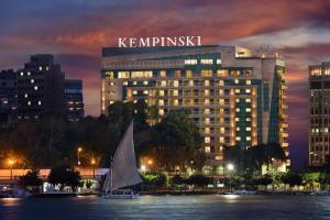 a sail boat in the water in front of a building at Kempinski Nile Hotel, Cairo in Cairo +139 photos