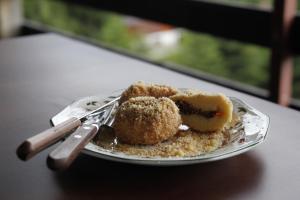 a plate with a piece of food on a table at Haus am Berg in Vartop