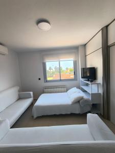 Ένα ή περισσότερα κρεβάτια σε δωμάτιο στο Apartamento Playa Pinar Golf
