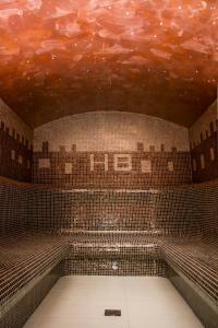 a tiled room with a ceiling with a cloud painted on it at Haus am Berg in Vartop
