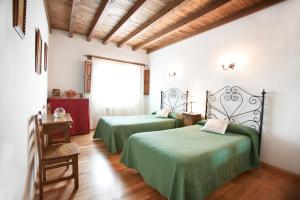 Posteľ alebo postele v izbe v ubytovaní Casa Rural El Regajo Valle del Jerte