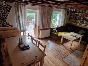 a living room with a couch and a table at House in Bohemian near Ski Slope in Mezihoří +32 photos
