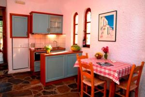 A kitchen or kitchenette at Kalives Apartments