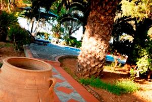 A garden outside Kalives Apartments