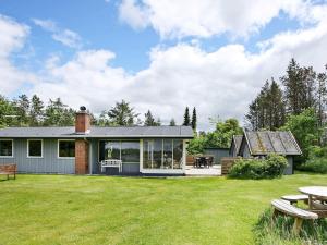a house with a yard with a picnic table at 10 person holiday home in Højslev-By Traum in Lund