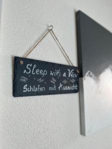 a sign that says sleep with a year in sittinian muskrit at Berggasthaus Eggberge - Boutique Mountain Hotel - Access via Cablecar in Altdorf +83 photos