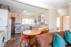 a living room with a table and a couch at Natspat 14 in Margate