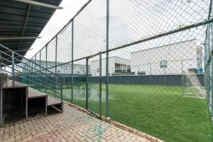 a batting cage with a soccer field in a building at 3 Bedroom Duplex for Shortlet in Ikota