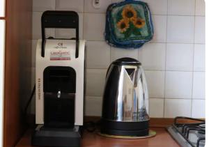 a kitchen counter with a blender and a toaster at Dimora Senese a due passi dal centro in Siena