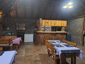 a dining room with tables and chairs in a building at Slypsteen Accomodation in Sternham