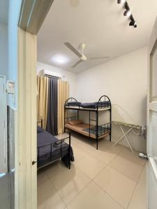 a hospital room with two bunk beds in it at Teratak Damai Smk Peramu jaya in Pekan