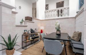a living room with a table and chairs at Casa Soleada in Capdepera