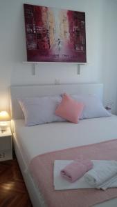 Posteľ alebo postele v izbe v ubytovaní Arco Arina Apartment