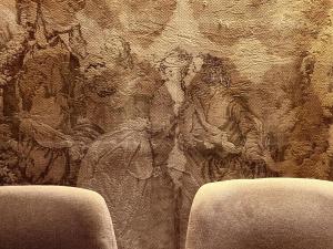 a wall with a tapestry with a painting on it at Allegretto Rialto in Venice
