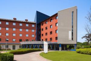 an external view of a building with a building at Dolce by Wyndham Milan Malpensa in Somma Lombardo +87 photos