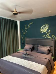 a bedroom with a bed with a snake laying on it at Crown plaza hotel and cafe in Kasol