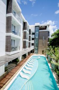 a swimming pool in the middle of a building at Boracay Haven Suites in Boracay