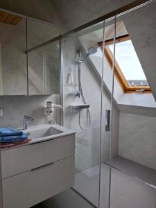 a bathroom with a sink and a shower at Ferienwohnungen Soravia in Gamlitz +18 photos