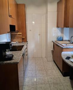 a small kitchen with a sink and a counter at Central Art House in Como