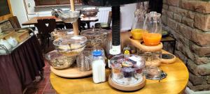 a table with a bunch of glass containers on it at Romantik-Pension Vogt in Offenburg