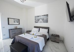 Ένα ή περισσότερα κρεβάτια σε δωμάτιο στο L'incanto Casa Vacanza