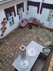 an overhead view of a patio with a table and chairs at Manzur in Bukhara