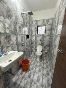 a bathroom with a sink and a toilet at Patnem Bliss in Canacona +70 photos