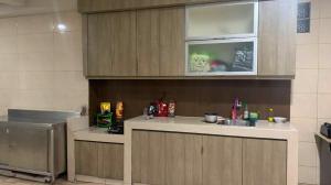 a kitchen with a sink and a counter top at PH Residence Jakarta - Gajahmada in Jakarta
