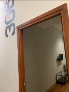 a doorway into a room with a sign on the wall at PH Residence Jakarta - Gajahmada in Jakarta