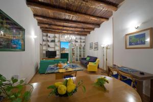 a living room with a table and a couch at Casa Ermelinda in Amalfi