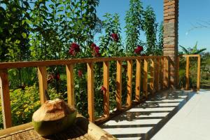 a hat sitting on top of a wooden bridge at Bintang Homestay in Tetebatu +2 photos